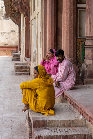Lahore, Pakistan - August 5, 2018: Local family sitting on the street in Lahore, Pakistan. Illustrative editorial.のeditorial素材