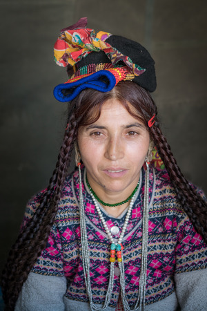 Ladakh, India - August 29, 2018: Portrait of a middle age indigenous woman in traditional colorful costume in Ladakh, India. Illustrative editorial.のeditorial素材