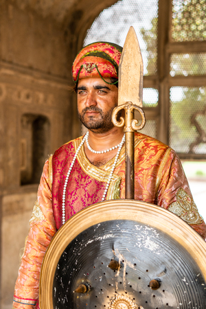 Lahore, Pakistan - August 5, 2018: Guard in historical costume in Lahore Fort in Pakistan. Illustrative editorial.のeditorial素材