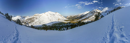 Pacific Crest Trail. A snow covered mountain range with a clear blue skyの写真素材