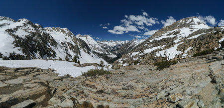Pacific Crest Trail. A mountain range with snow on the peaks and a clear blue skyの写真素材