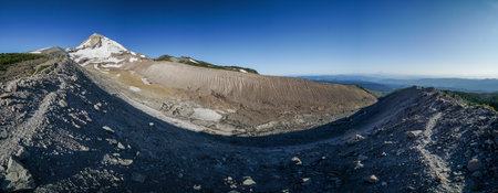 Pacific Crest Trail. A mountain range with a large crater in the middle. The sky is clear and blue