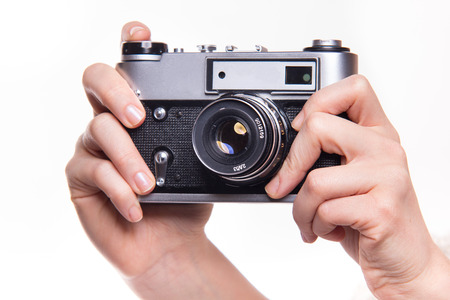 Classic 35mm old analog camera on white - studio shootの写真素材