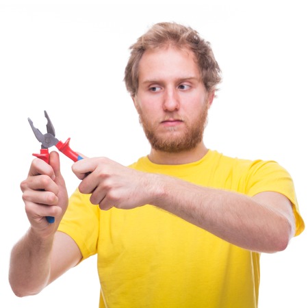 Handyman holding pliers - studio shootの写真素材