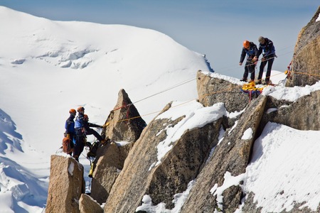 Alpine climbers climbing on a rock in the Mont Blanc massif in France, 20.09.2012の写真素材