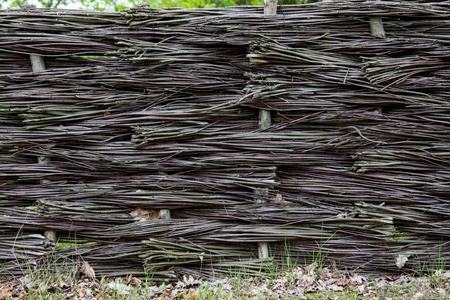 Braided wicker fence in the countryside, Polandの写真素材