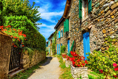Beautiful colorful medieval alley in Yvoire town in Franceの写真素材