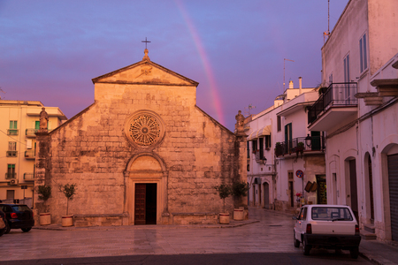 Scenic Madonna della Greca Church and rainbow in Locorotondo, Italyの写真素材