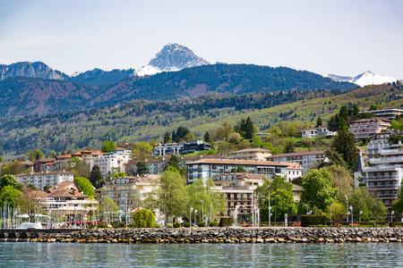 Geneva Lake shore and mountains in Evian-les-Bains city in Franceの写真素材
