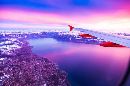Amazing view from the airplane window during the sunset over Geneva Lake, Switzerland