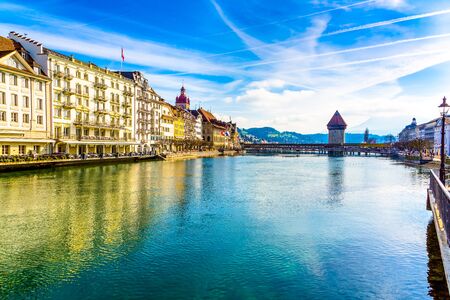 Old town buildings over Reuss river in Lucerne city in Switzerland