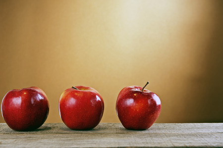 Polish red apples on a wooden tableの写真素材