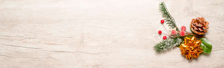 Christmas decoration with golden star and tree in snow on wooden backgroundの写真素材