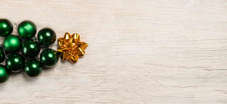 Christmas background with a Christmas tree with baubles and a golden starの写真素材