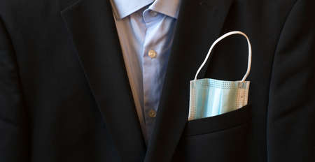 protective mask in jacket pocketの写真素材