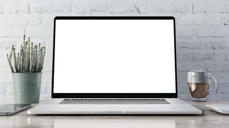 Laptop blank screen on white wooden table with mouse, smartphone, cup of coffee and heather flower. Home interior or office backgroundの写真素材