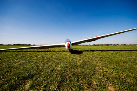 Front view of a glider on grass airfieldの写真素材