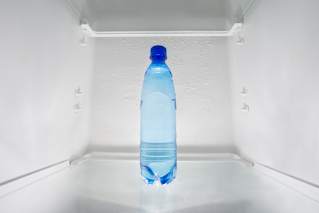 Bottle of water in fridge.の写真素材