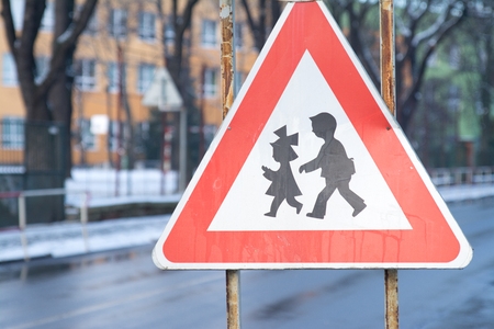 Road sign, for drivers to pay attention that the road can pass the children.の写真素材