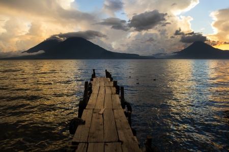 Sunset on Lake Atitlan with volcano in backgroundの写真素材