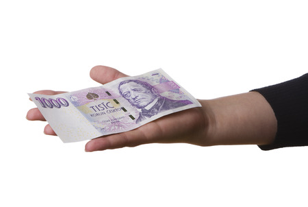 One thousand Czech crowns on hand, isolated on whiteの写真素材