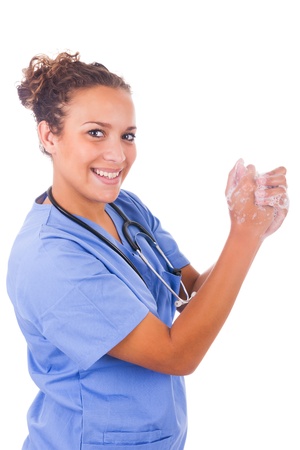 young nurse washing hands with soap isolatedの写真素材