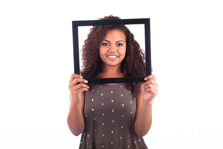 Woman with a frame around her face isolated over a white backgroundの写真素材