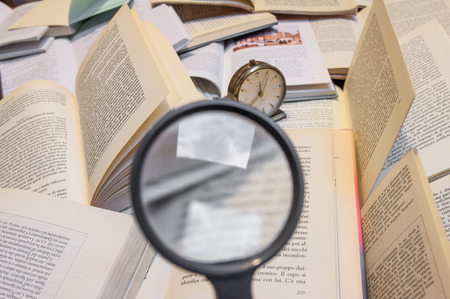 magnifyng glass and booksの写真素材
