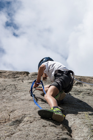 child climbs the cliffの写真素材