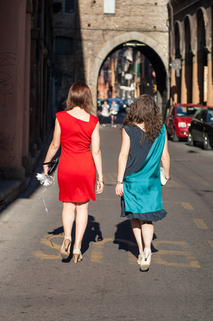 girls walking down the streetの写真素材