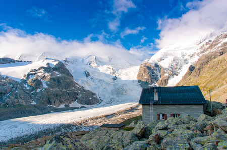 alpin hut above the glacierの写真素材