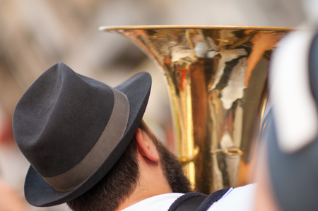 man plays his tuba during an outdoor partyの写真素材