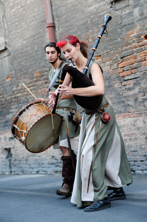 FERRARA, ITALY -12 August 2012:  Street musician medieval style  to Ferrara busker festival, Italy