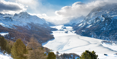 The valley of Engadine St. Moritz Switzerland with frozen lakesの写真素材