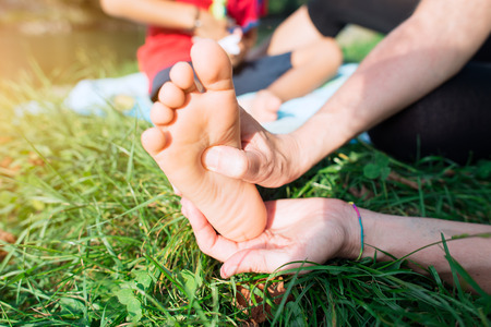 Reflexology foot of a child in natureの写真素材