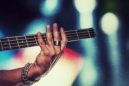 Rock bassist in concert vintage style photograph