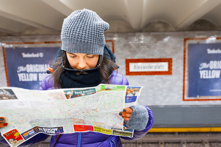 Berlin , Germany - November  28, 2016: Girl looks at the map of the city of Berlin in the subwayのeditorial素材