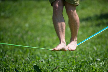Walk in balance on rope barefoot in the park