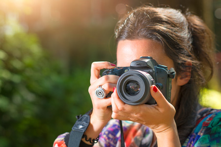 Girl photographer lens system to photograph.の写真素材