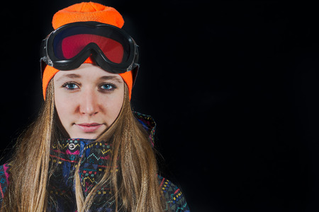 Portrait of girl with ski mask and snowboard.の写真素材