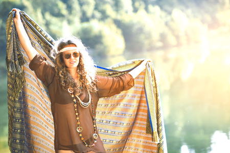 Pretty free hippie girl with a cloth. Outdoor in peace and free love. Top view - Vintage effect photoの写真素材