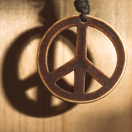 Symbol of peace love and not war of wood with shadow.の写真素材