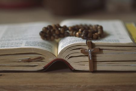 Detail of rosary crown on the gospel.の写真素材