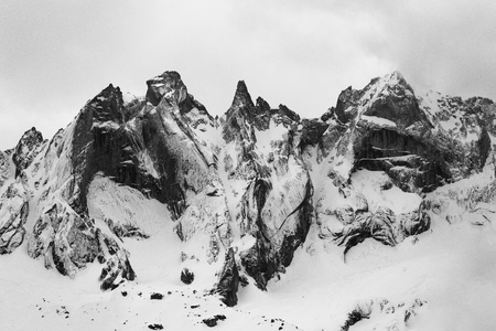 Detail of the Sciero group in the Rhaetian  Alps in Switzerland. Black and white fine art mountain winter.の写真素材
