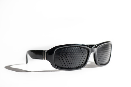 Anti Myopia Glasses with holes for vision correction on white background.の写真素材