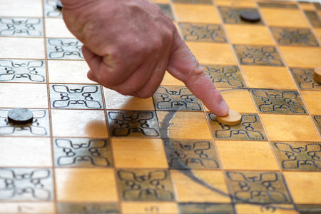 Chessboard with game of checkers.