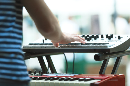 Keyboard player of a pop group during a show.の写真素材