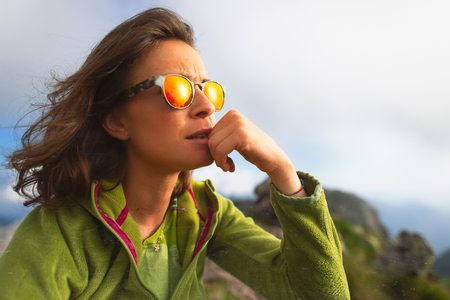 Portrait of caucasian girl resting during an alpine trekking.の写真素材
