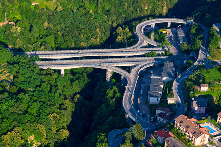 High angle view of road and cross bridges in the nature of woods near Lake Lecco Italy.のeditorial素材