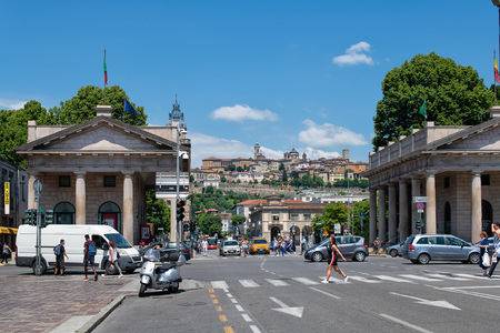 BERGAMO, ITALY - June 26, 2018: Life of the city center of Bergamo with the upper city in the background